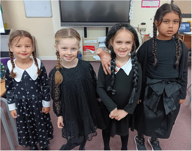 A group of girls in black dresses

Description automatically generated