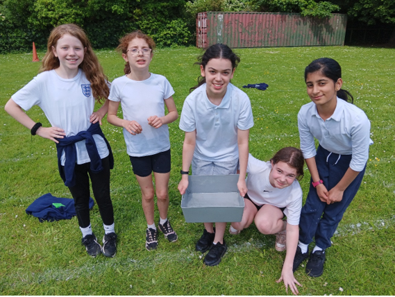 A group of girls posing for a picture

Description automatically generated