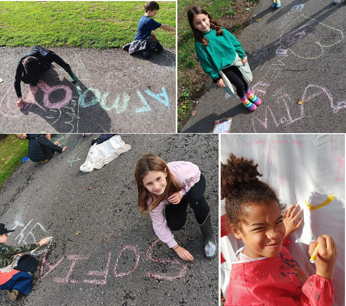 A group of kids playing with chalk

Description automatically generated