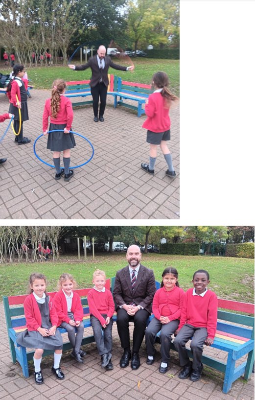 A person and a group of girls sitting on a bench

Description automatically generated