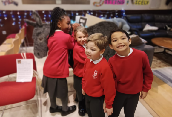 A group of children in red sweaters

Description automatically generated